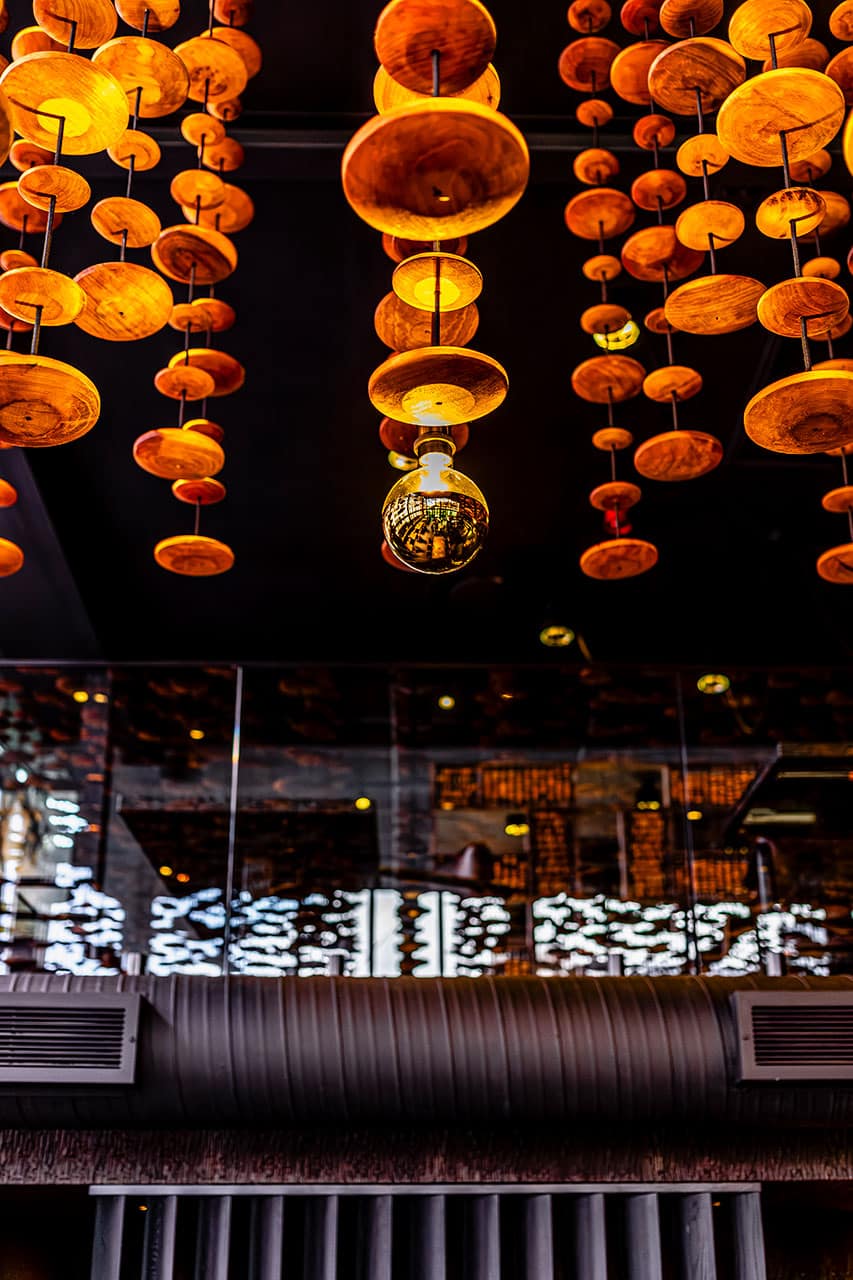 Fyn Restaurant in Cape Town modern interior design with golden african hanging feature