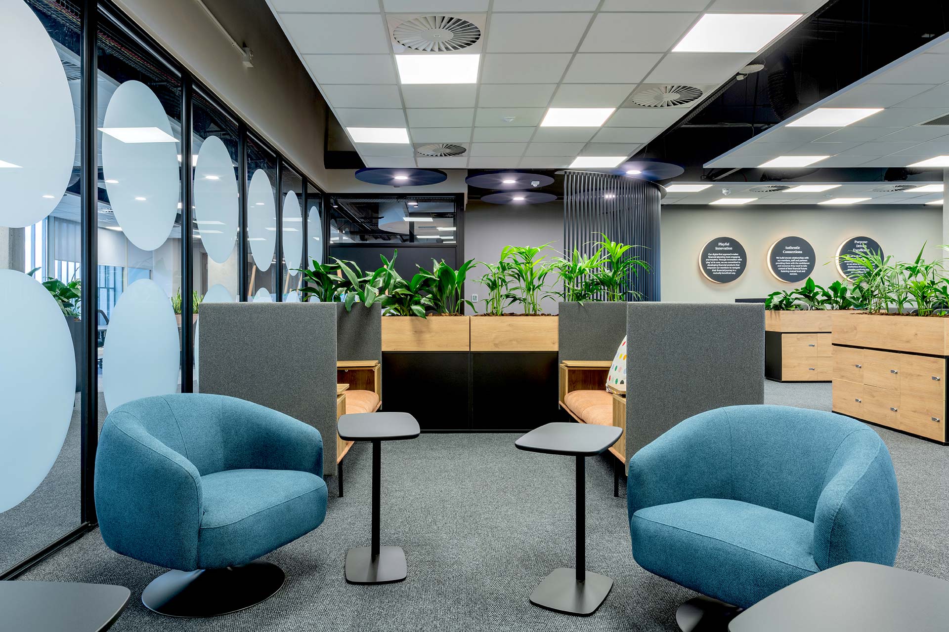 PPS large financial office interior design and build with modern booth seating furniture and greenery
