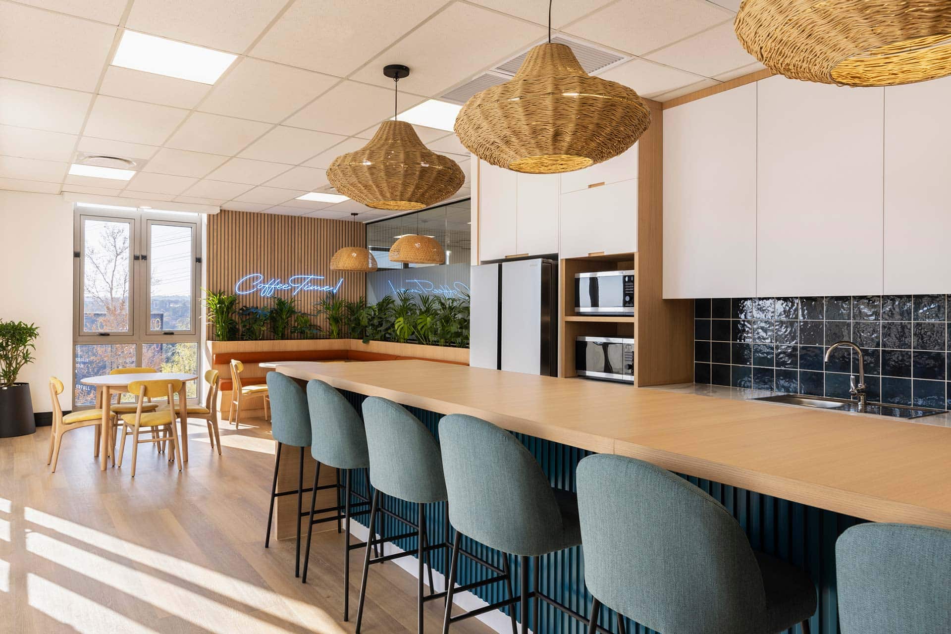 Sandoz pharmaceutical office canteen area design with modern furniture and lighting fitout