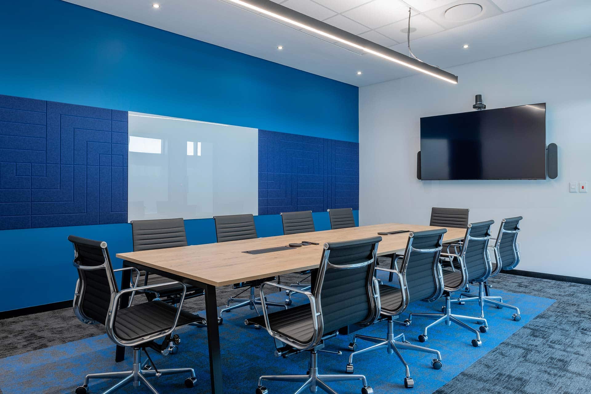 corporate office boardroom design with hi tech technology and booking system