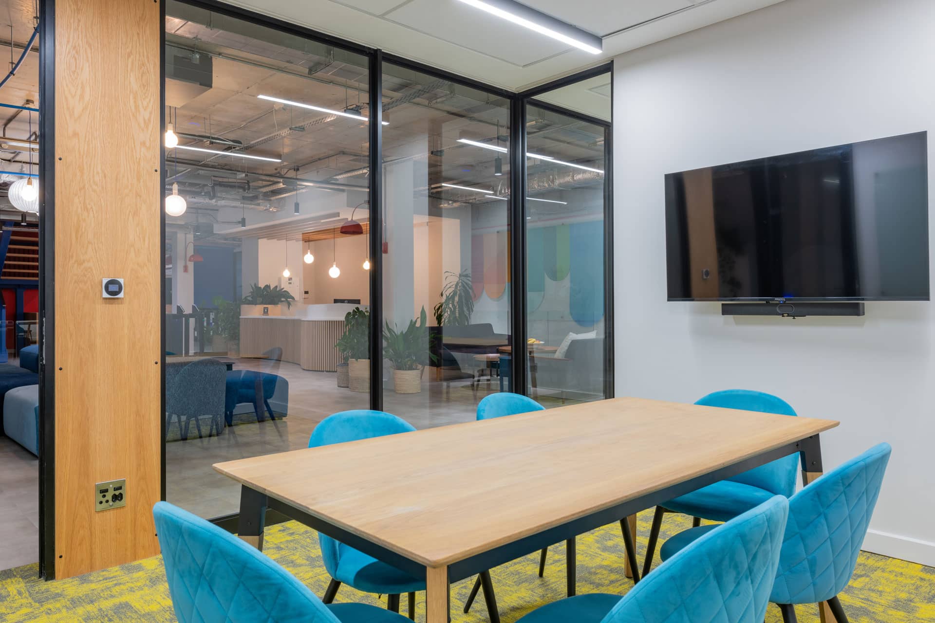 Blue chairs in a small meeting room