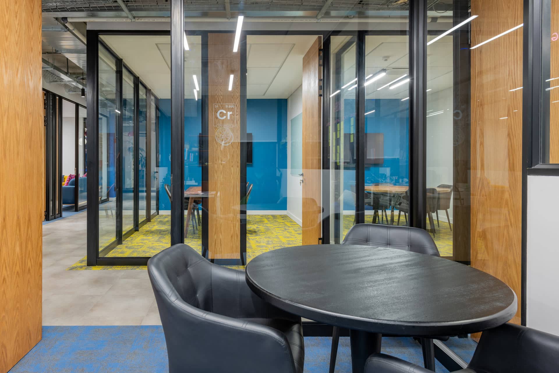 Office meeting room with black soft chairs