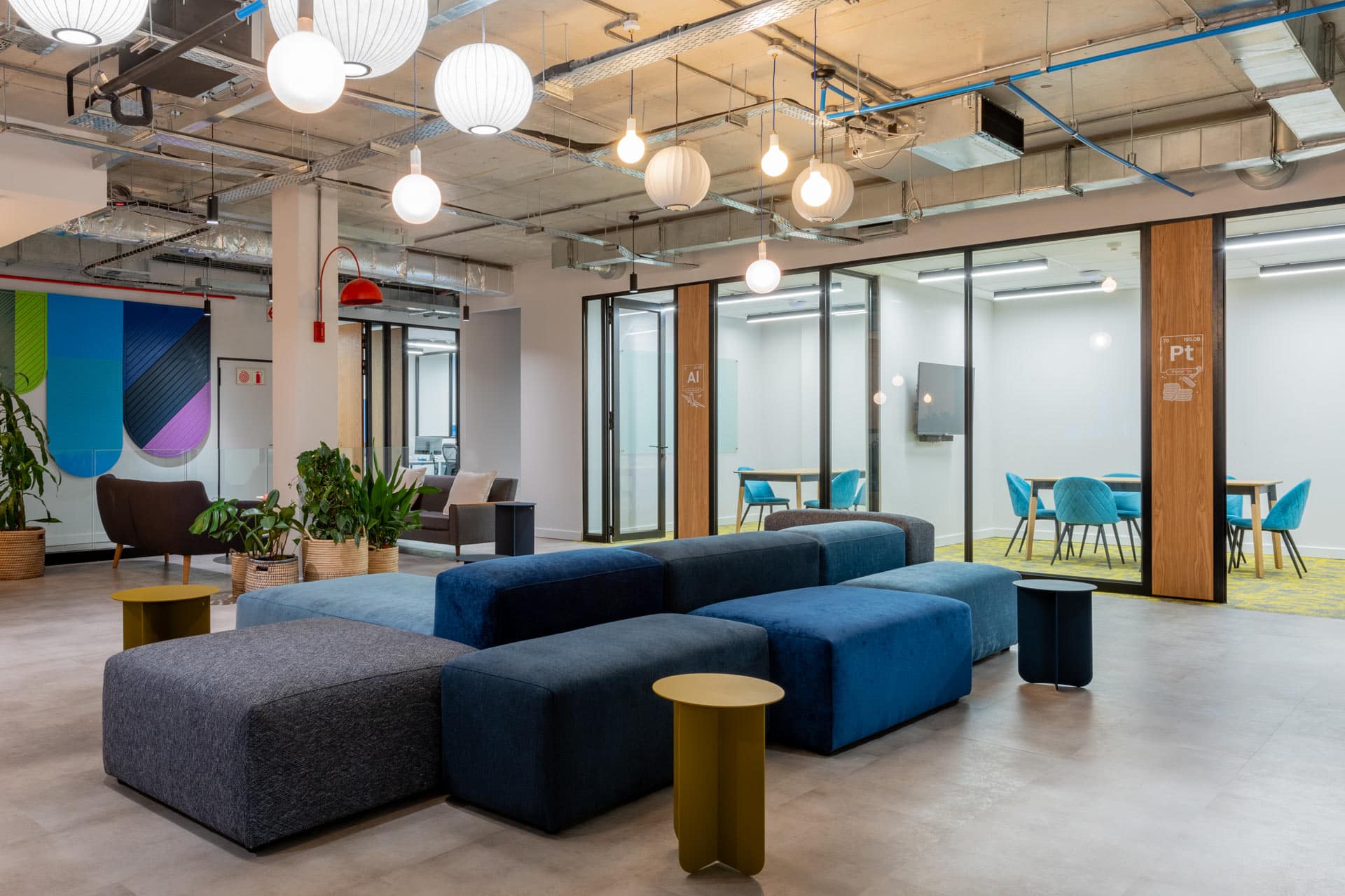 Soft seating and fun lighting and small meeting rooms