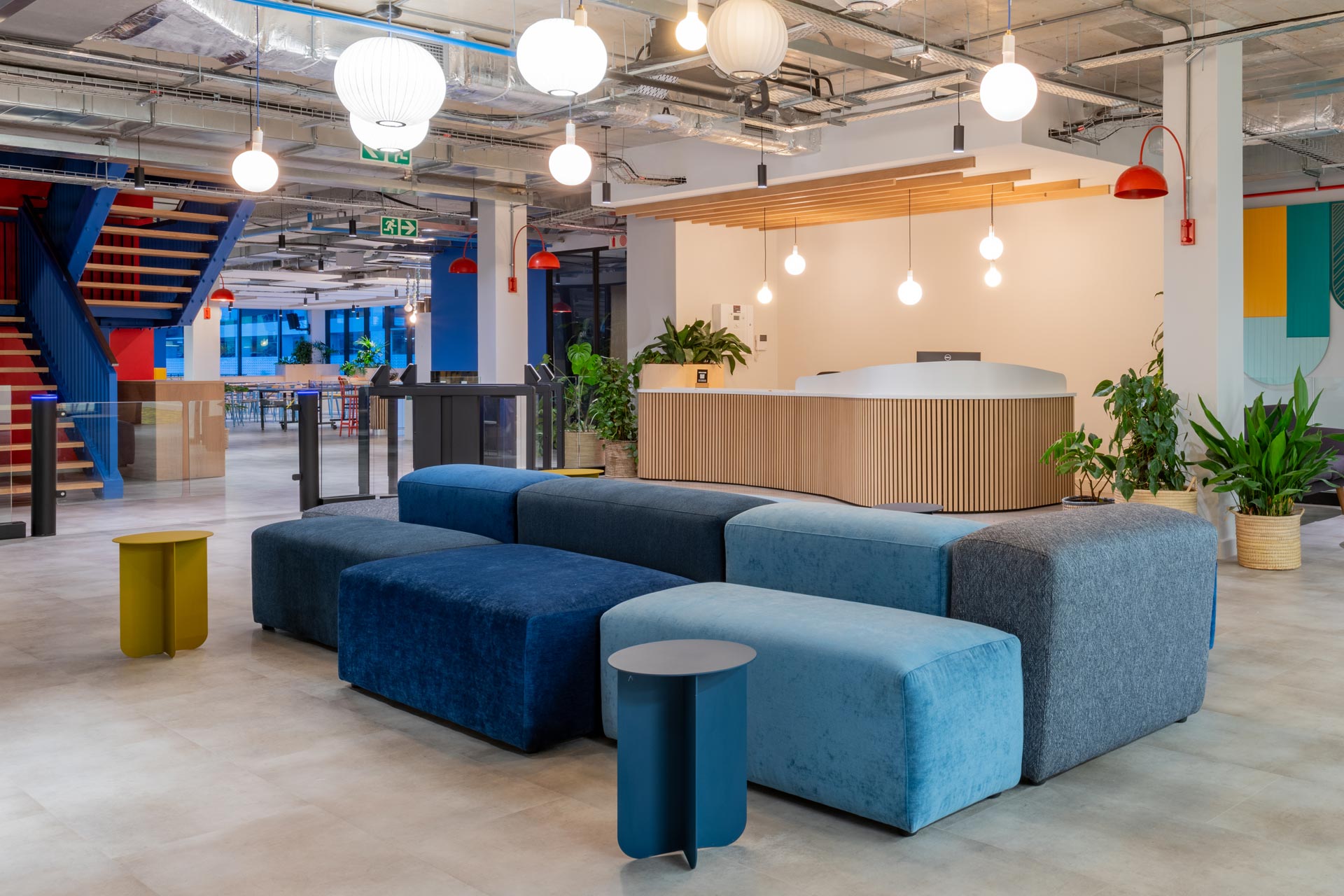Waiting area with colourful sofas and electronic entrance