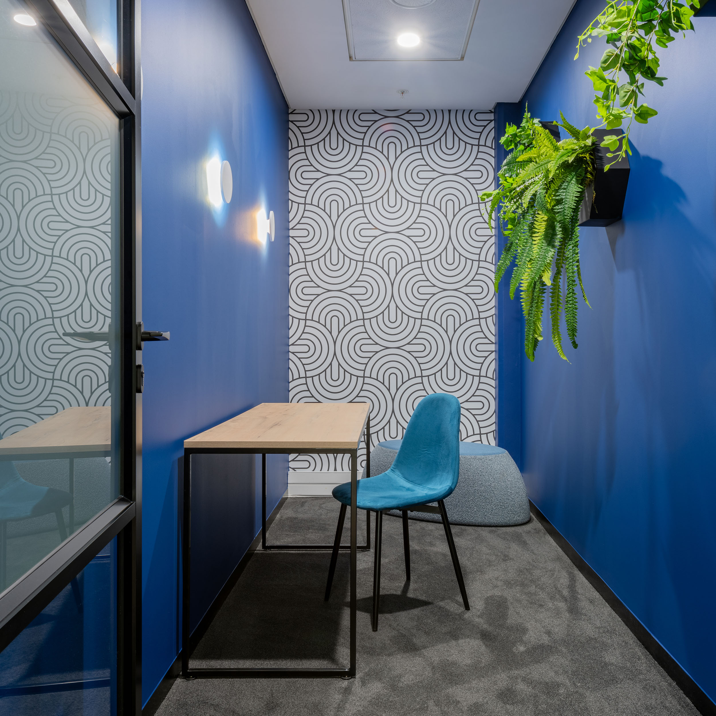 Private booth for making calls offers colourful breakaway space in new hvac office