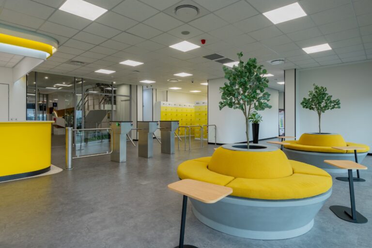 Colourful yellow reception area for bpo commercial office fit out