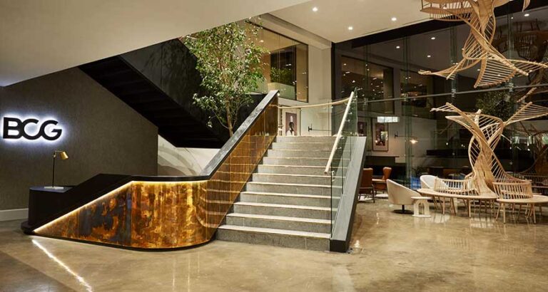Commercial office building reception with technial construction ofstaircase and custom joinery built by Trend Group SA