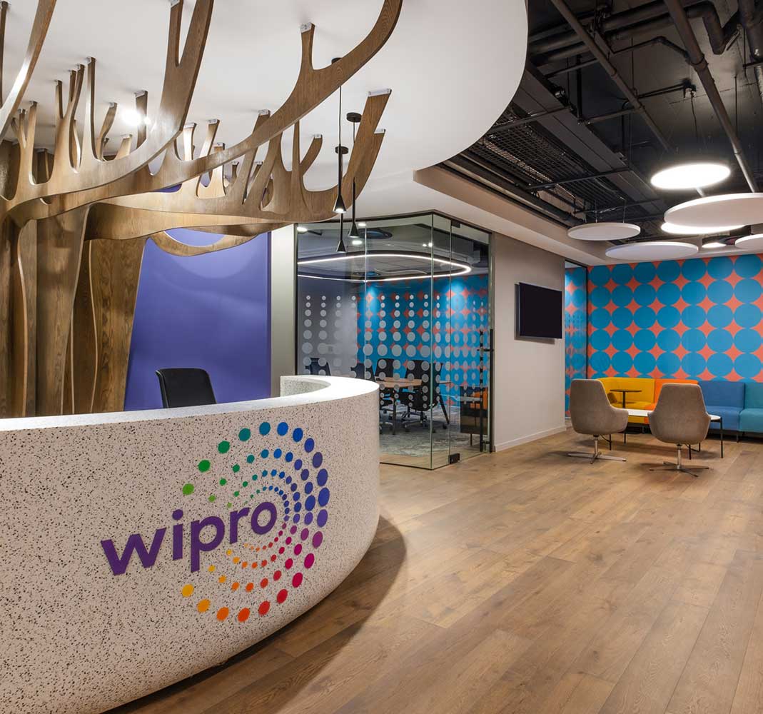 A creative reception design with branding and custom joinery designed and built by trend group