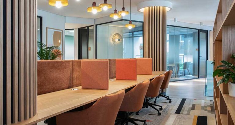 Modern office fit-out example with shared desks and partitioning