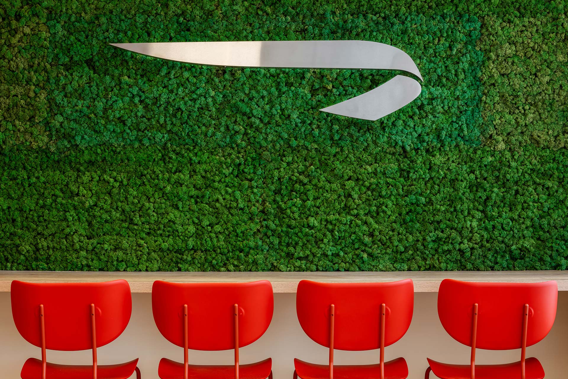 BA Euroflyer office canteen interior design and fit-out and furniture procurement with wooden high table and modern red bar stools
