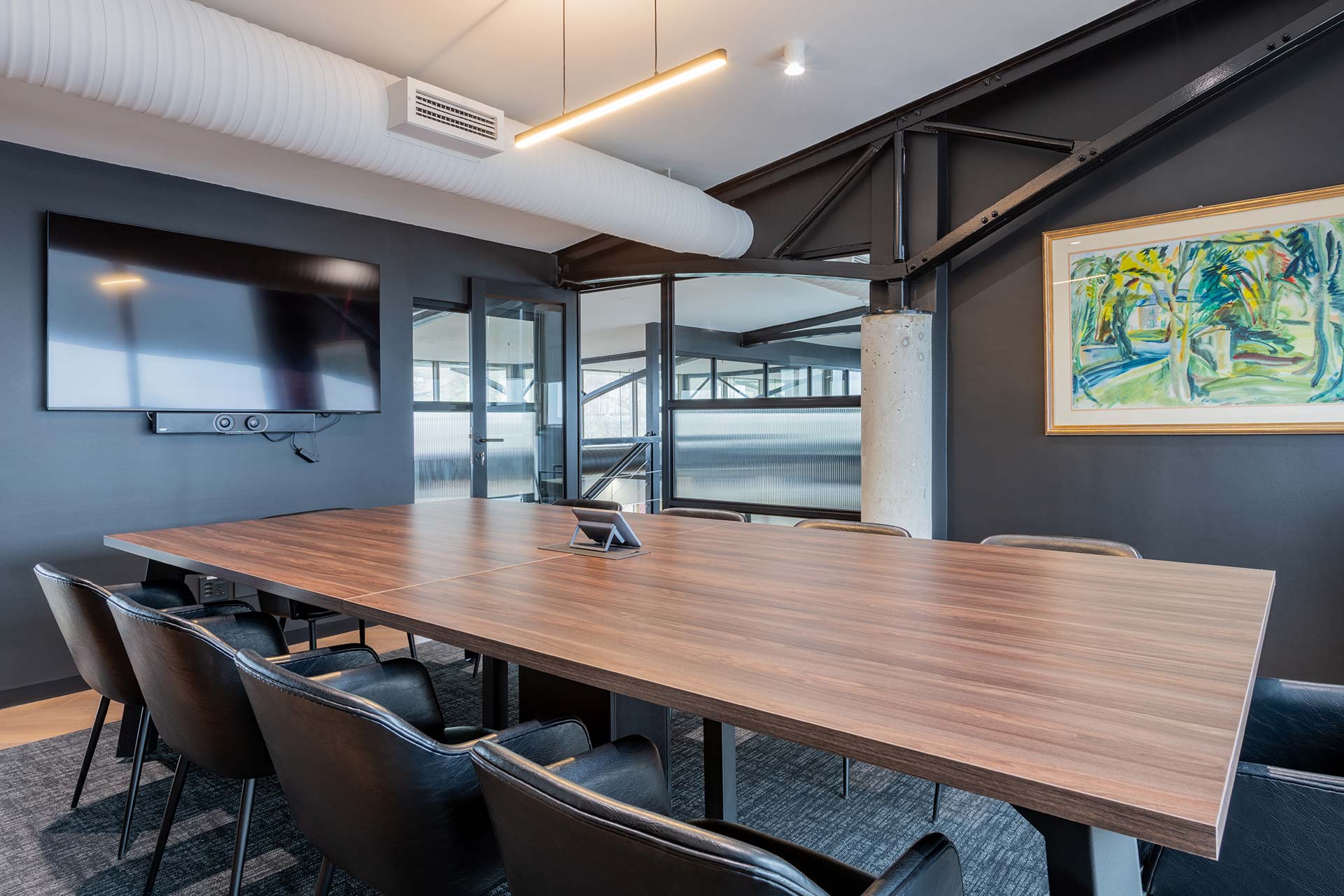 Lionhead Capital office redesign with mezzanine boardroom with timber conference table and modern office chairs