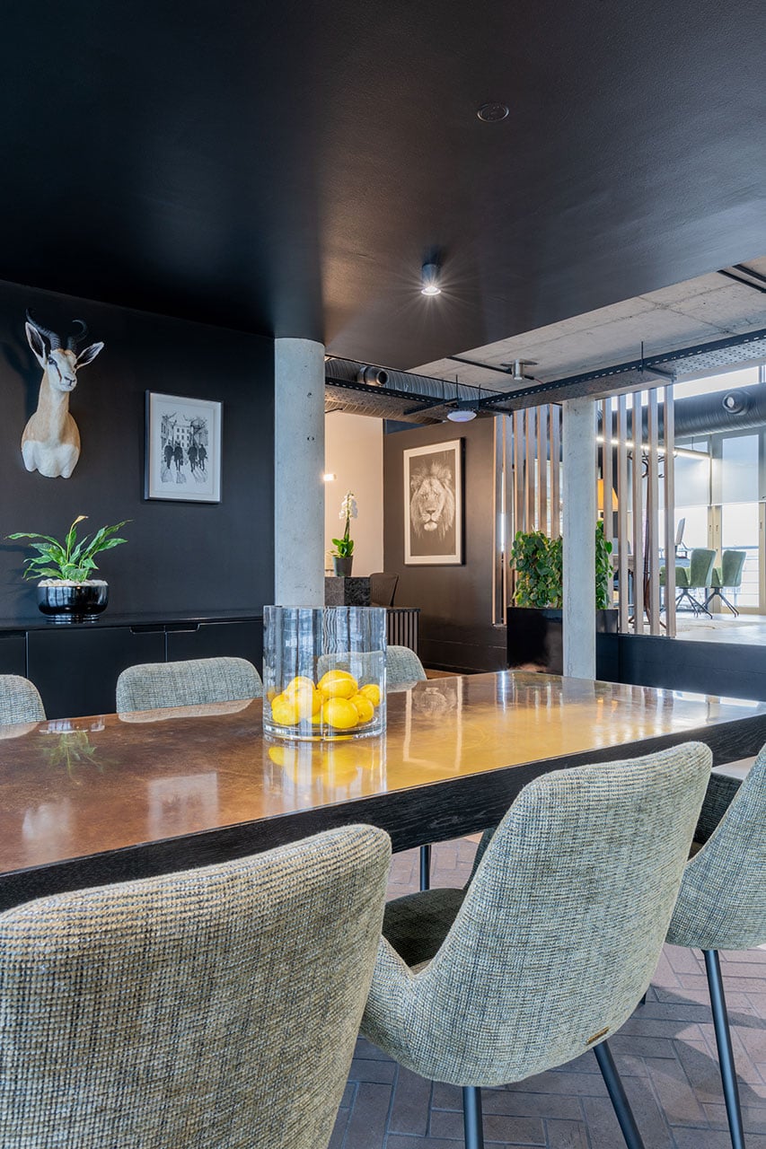 Lionhead Capital modern meeting boardroom interior design with timber table, upholstered chairs